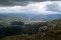 Rocky cliffs of Vlasic mountain and hazy valley with villages