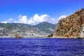 Rocky coast of Alanya Turkey and a ship in the blue water of the Mediterranean Sea. Beautiful panorama of the Turkish Riviera