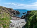 The rocky coast of the Atlantic Ocean on a sunny spring day. Seaside Irish landscape. Picturesque rocks on the shore, rock Royalty Free Stock Photo