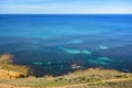 Rocky coast of calm Mediterranean sea with underwater rocks