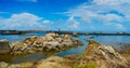 The rocky coast with clear clouds sky background Royalty Free Stock Photo