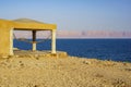 Rocky coast of Dead Sea. Jordan. Calm on Dead Sea. Emerald water of Dead Sea against blurred background Royalty Free Stock Photo