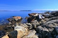 Rocky Coast and Driftwood at Sidney with Gulf Islands, Saanich Peninsula, Vancouver Island, British Columbia Royalty Free Stock Photo