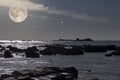 Rocky coast in a full moon night Royalty Free Stock Photo