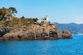 White Lighthouse and Rocky Coast of Portofino - Genoa Liguria Italy Royalty Free Stock Photo