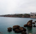 The rocky coast of the Mediterranean Sea. There are hotels on the shore. Antalya, Turkey, April 6, 2019 Royalty Free Stock Photo