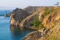 The rocky coast of Olkhon island on a summer evening in the rays of the setting sun. Royalty Free Stock Photo