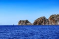 Rocky coast of the peninsula in Alanya against the background of the sea horizon with two tourist ships Turkey. Seascape with Royalty Free Stock Photo