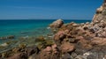 Rocky coast of tropical island during outflow Royalty Free Stock Photo