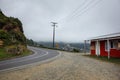 Curved mountain road along closed shop