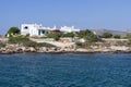 Rocky coast and white houses in Antiparos island