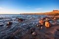 Rocky coastal scene in warm sunrise light