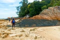 Rocky island coastal scenery during low tide at Besar Island or Pulau Besar in Mersing, Johor, Malaysia