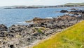 Rocky coastal shoreline at Inishbofin or White Cow Island with the horizon over the Atlantic Ocean