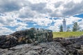 Rocky coastal views with iconic lighthouse at Blowhole Point, south of Kiama Harbour, in cloudy sky day.