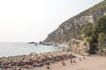 Rocky coastline, bay, beach. People are sunbathing. Europe.