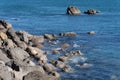 Rocky coastline with blue sea around Base Track Mount Maunganui