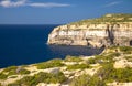 Rocky coastline cliffs near collapsed Azure window, Gozo island, Malta Royalty Free Stock Photo