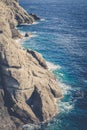 Rocky coastline and cliffs with waves crashing