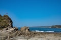 Rocky Coastline With Costa  Rican Flag Royalty Free Stock Photo