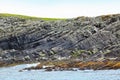 Rocky coastline of the Island, with waves of the ocean splashing, Mousa Island, Shetland, Scotland