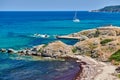 Rocky coastline landscape with yacht Royalty Free Stock Photo