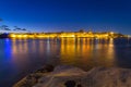 Rocky coastline of Malta and the architecture of Valletta city at night Royalty Free Stock Photo