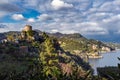 Rocky coastline with medieval castle ruins on hill near Portofino town, Italy Royalty Free Stock Photo