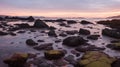A rocky coastline with tide pools, catching the last light of the day Royalty Free Stock Photo