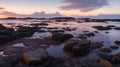 A rocky coastline with tide pools, catching the last light of the day Royalty Free Stock Photo