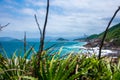 rocky coastline with turquoise-green water, green slopes and an absolutely blue sky Royalty Free Stock Photo