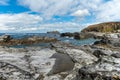 Rocky Cornwall coast with the Godrevy Lighthouse behind