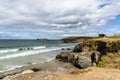 Rocky Cornwall coast with the Godrevy Lighthouse behind