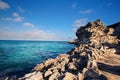 Rocky cove and ocean wave crashing into an eroded arch Royalty Free Stock Photo