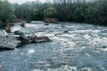 Rocky fast river. Running water, flowing with rapids Royalty Free Stock Photo
