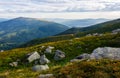 Rocky formations on the grassy hills Royalty Free Stock Photo