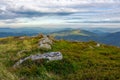 Rocky formations on the grassy hills Royalty Free Stock Photo