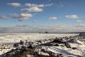 Rocky frozen Lake Superior shoreline with lighthouses and shipping pier in Duluth, Minnesota, USA in winter. Royalty Free Stock Photo