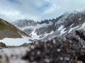 Rocky gray mountains with thawed patches