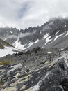 Rocky gray mountains with thawed patches