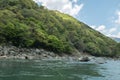 Rocky green hills along Hozugawa River.