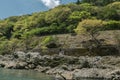 Rocky green hills along Hozugawa River.