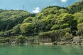 Rocky green hills by Hozugawa River.