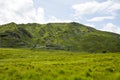 Rocky green mountains and fields