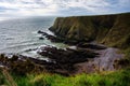 Rocky headland coast of Eastern Scotland at Dunnottar Castle near Stonehaven Aberdeen Aberdeenshire Royalty Free Stock Photo