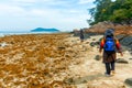 Rocky island coastal scenery during low tide at Besar Island or Pulau Besar in Mersing, Johor, Malaysia