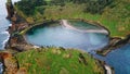 Rocky island lagoon drone shot. Picturesque coastline at green nature landscape Royalty Free Stock Photo