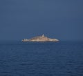 Rocky Palmaiola island with lighthouse, Elba Royalty Free Stock Photo