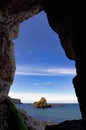 Rocky Island and Sheep Island view from a cave in the Antrim Coast Royalty Free Stock Photo