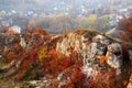 Rocky landscape during autumn. Beautiful landscape with stone, forest and fog. Misty evening autumn landscape. Landscape with rock
